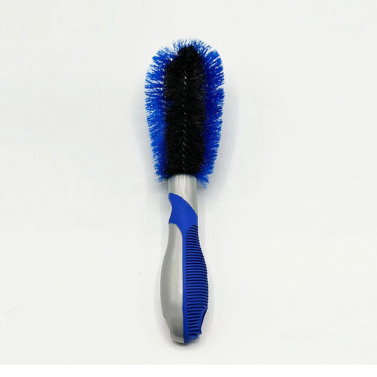 Car wheel cleaning brush with blue and black bristle ends on a gray handle