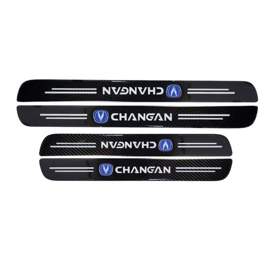 Set of black carbon-fiber door sill guards with CHANGAN logo and silver trim lines