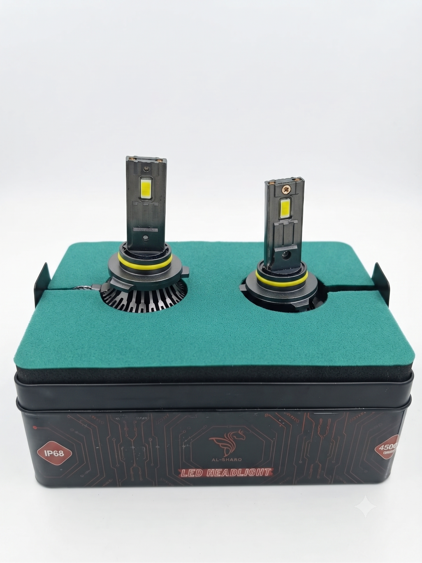 Pair of LED headlight bulbs on black base, with yellow COB chips and metal caps