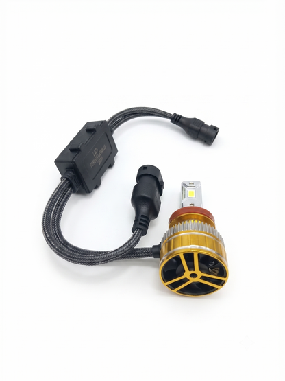 H11 LED headlight bulb with black wiring harness and gold ring bulb