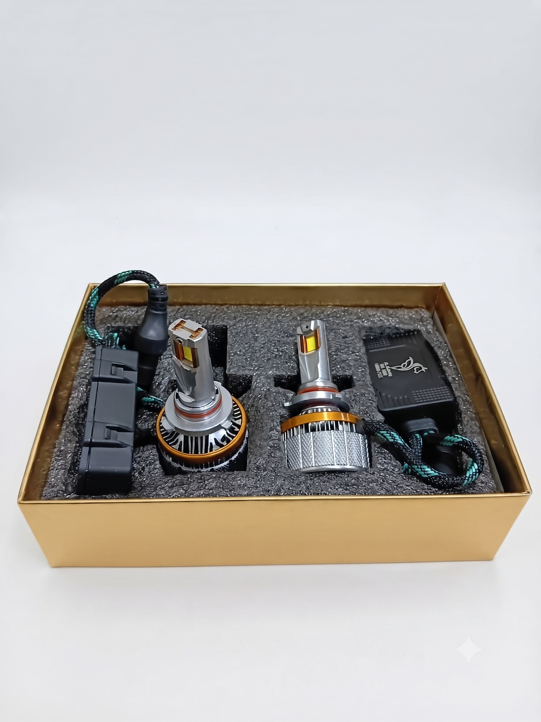 9005 LED headlight bulb kit tray with two bulbs, harness wiring, and spare modules