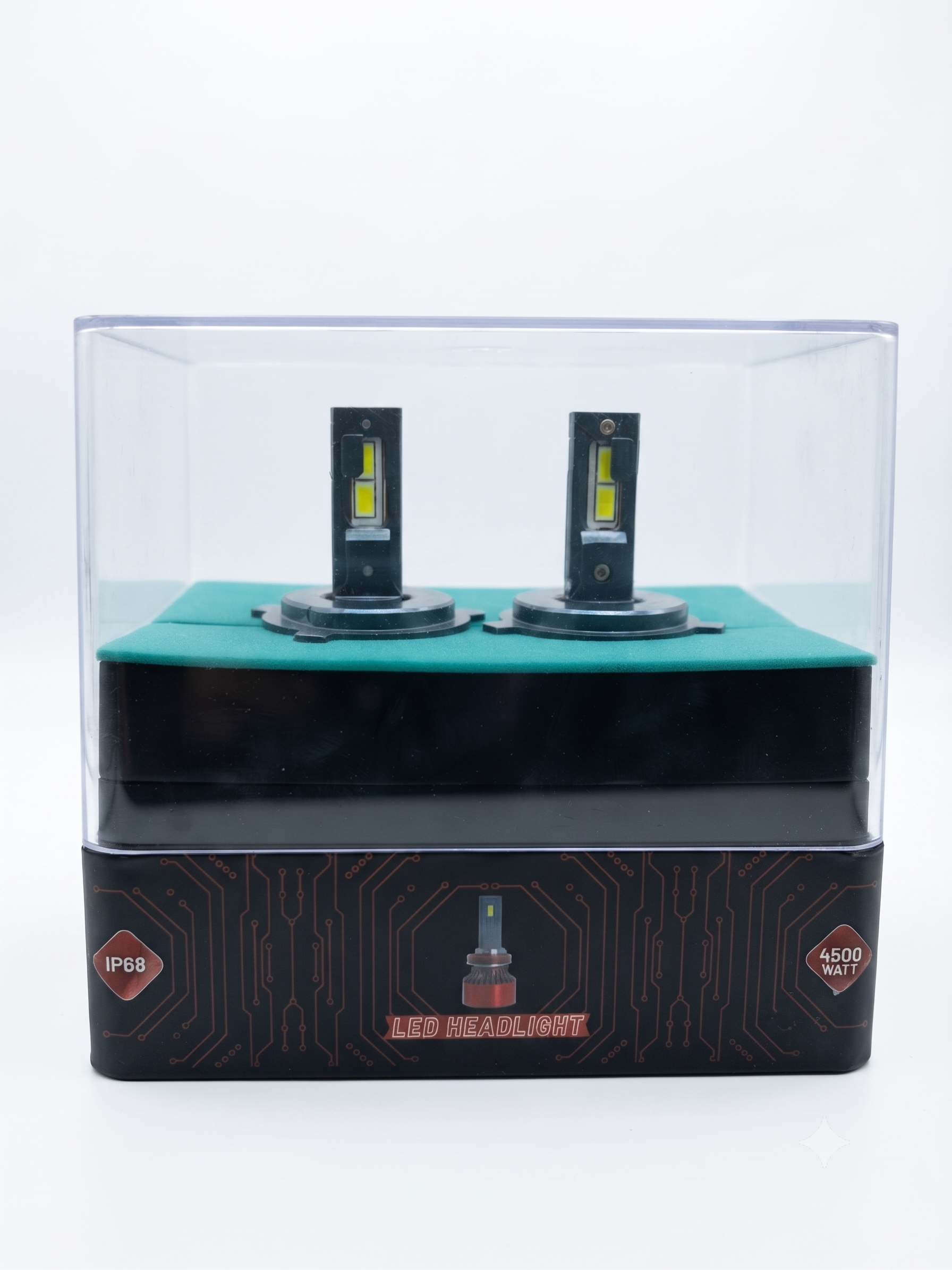 Pair of LED headlight bulbs in clear display box on black and green top