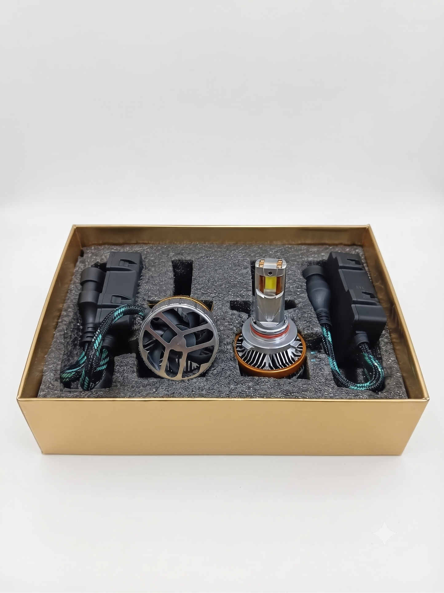 9005 LED headlight bulb kit in open box with two bulbs, wiring, and connectors