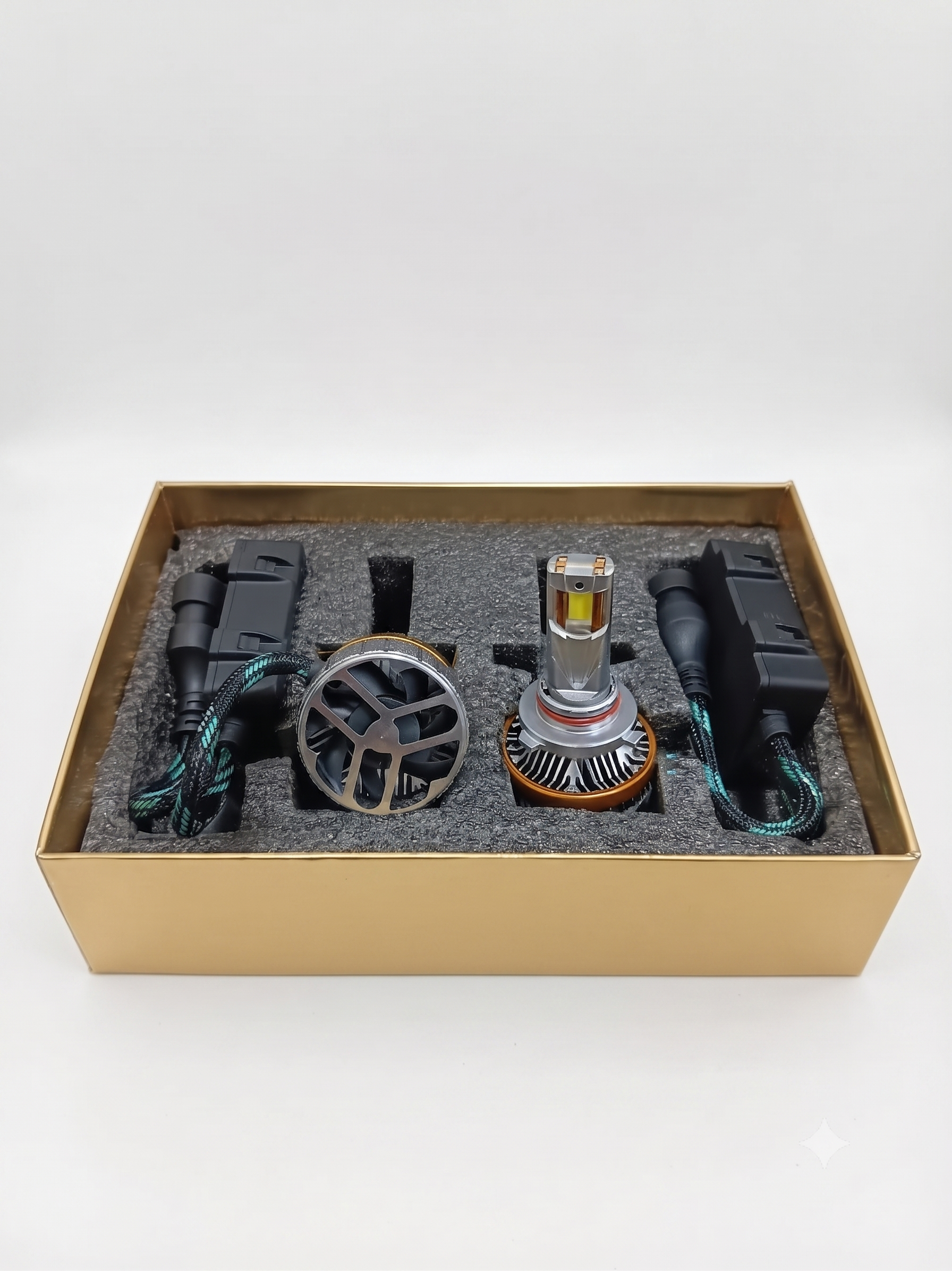 9005 LED headlight bulb kit in open box with two bulbs, wiring, and connectors