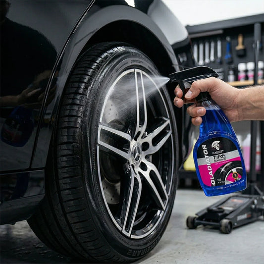 Tire shine spray bottle applying gloss to car tire and alloy wheel