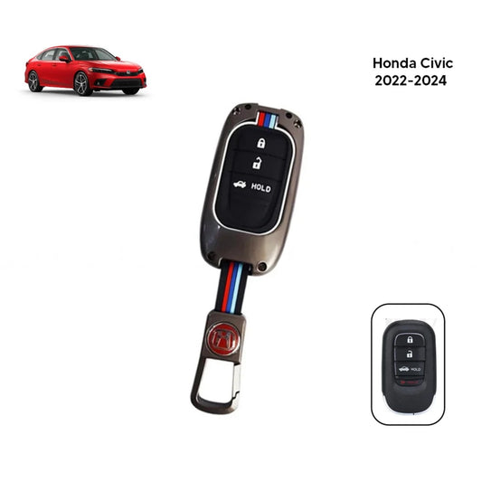 Metal key fob cover with black silicone face, metallic shell, and lock/unlock buttons