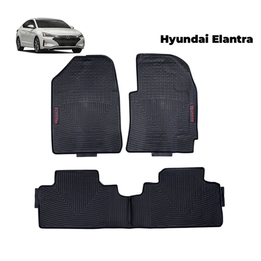 Black rubber car floor mat set with textured channels and raised nibs, rear and front