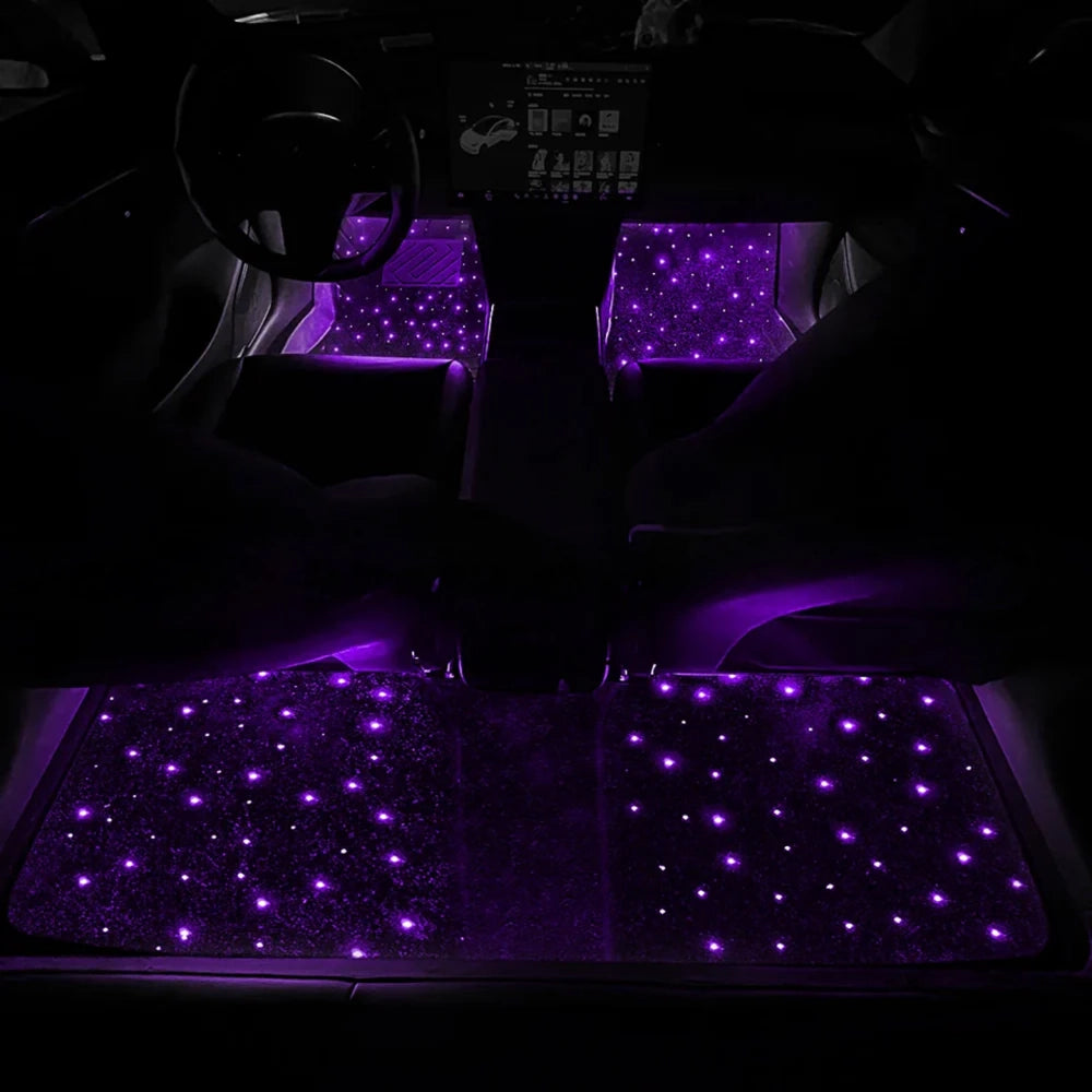 Car floor mat set with purple fiber-optic star lights glowing across the front area