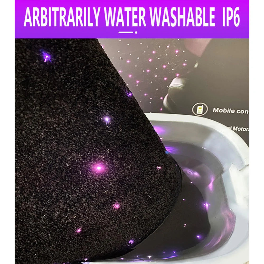 Close-up of black fiber-optic car floor mat with purple star lights near the seat