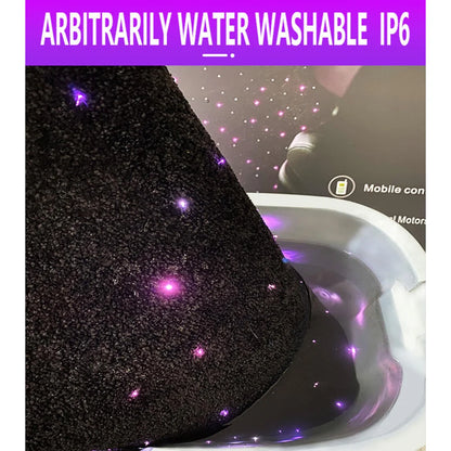 Close-up of black fiber-optic car floor mat with purple star lights near the seat