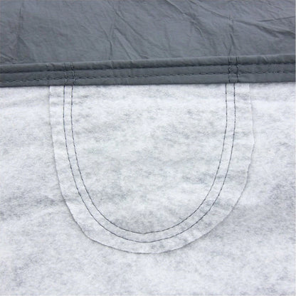 Gray non-woven car cover edge with curved stitched seam and reinforced stitching