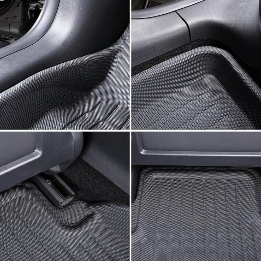Black TPE floor mat texture with raised ridges and channels near vehicle console area