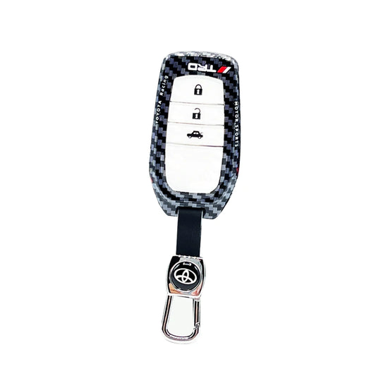 Carbon-fiber style key fob case with Toyota logo on black key ring