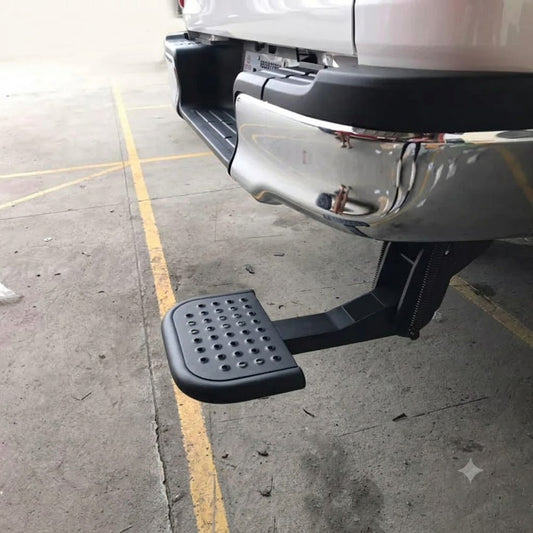 Retractable rear bumper T-step with black perforated foot plate
