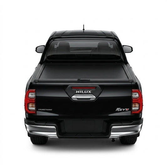 Black ABS cargo bed shutter cover with center latch on pickup truck bed