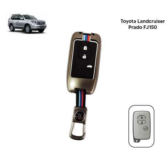 Metallic key fob cover with buttons, attached key blade and keyring, shown with spare face