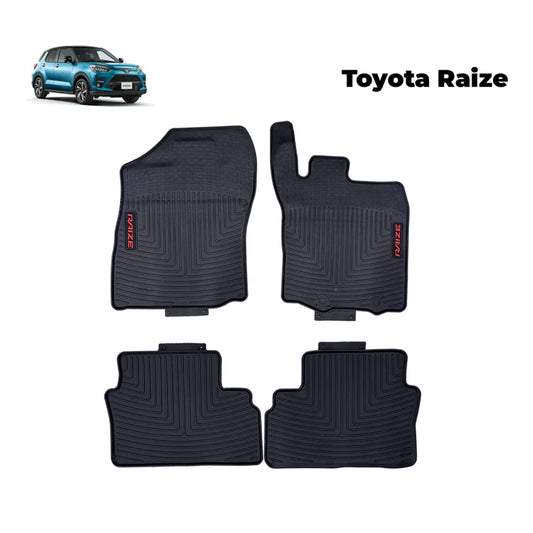 Set of four black Toyota Raize rubber floor mats with molded grooves