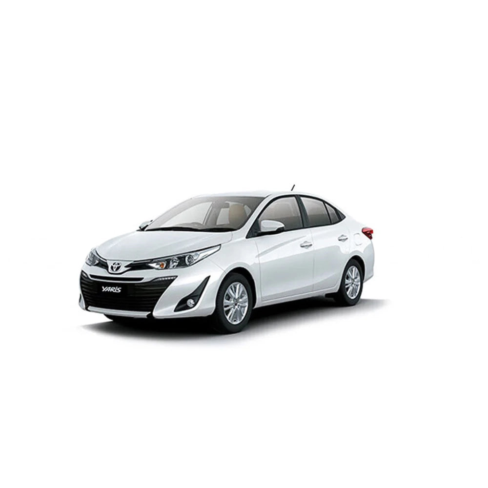 White Toyota Yaris sedan, front three-quarter view