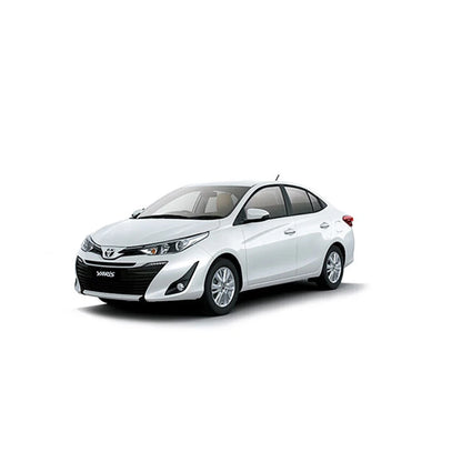 White Toyota Yaris sedan, front three-quarter view