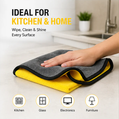 Folded microfiber cleaning towel with black edging, yellow and dark gray layers